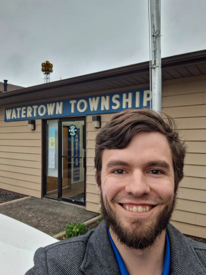 Brendan Johnson outside the Watertown Township hall during the District 26 listening tour